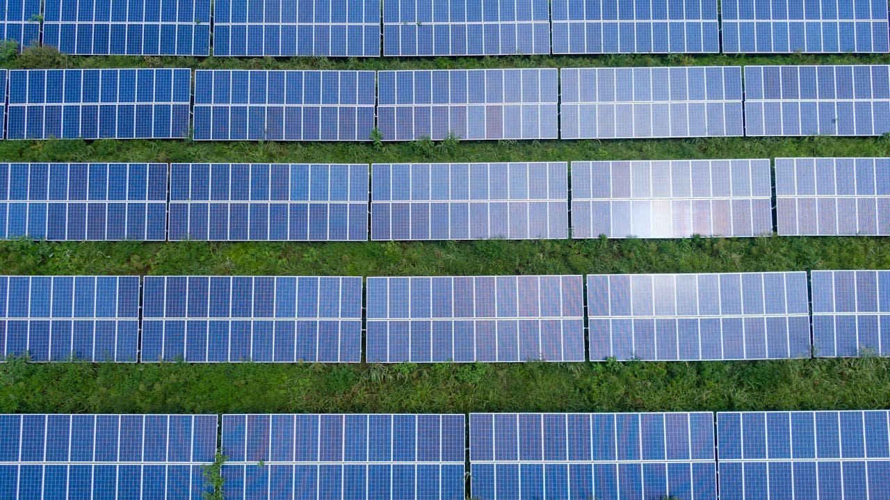 Aerial shot of a solar panel array generating renewable energy in Trenton, Georgia.